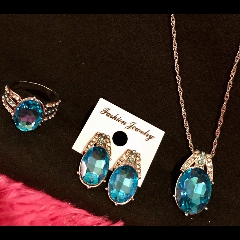 Aquamarine colored ring, earrings and pendant set